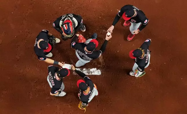 Cleveland Guardians pitcher Shawn Armstrong leaves the game against the Tampa Bay Rays during the second inning in Game 6 of an American League Championship Series baseball game in St. Petersburg, Fla. Monday, Oct. 19, 2026. (AP Photo/David J. Phillip)