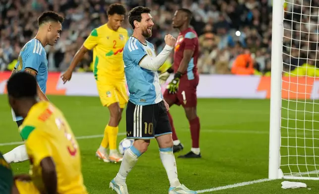 Argentina's Lionel Messi celebrates scoring his side's third goal from the penalty spot during an international friendly soccer match against Benin, marking his farewell appearance for the national team, in Buenos Aires, Argentina, Tuesday, Oct.6, 2026. (AP Photo/Gustavo Garello)