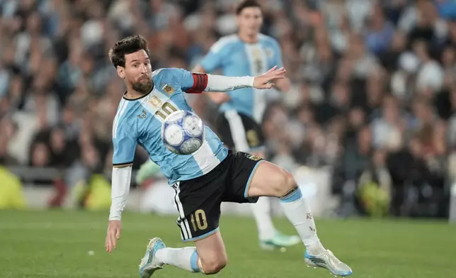 Argentina's Lionel Messi controls the ball during his final match for the national team, a soccer friendly against Benin, in Buenos Aires, Argentina, Tuesday, Oct.6, 2026. (AP Photo/Natacha Pisarenko)