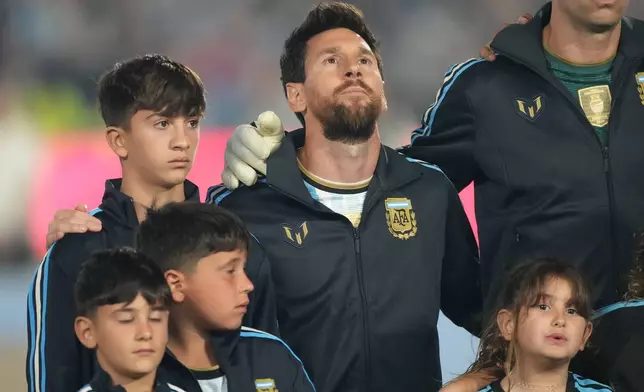 Argentina's Lionel Messi stands for the national anthem during an international friendly soccer match against Benin, marking his farewell appearance for the national team, in Buenos Aires, Argentina, Tuesday, Oct.6, 2026. (AP Photo/Gustavo Garello)