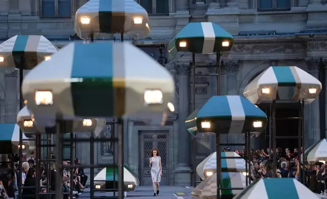 A model wears a creation as part of the Louis Vuitton Womenswear Spring Summer 2027 collection presented in Paris, France, Tuesday, Oct. 6, 2026. (AP Photo/Aurelien Morissard)