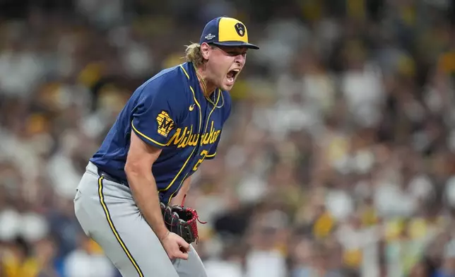 Milwaukee Brewers pitcher Trevor Megill celebrates after getting the final out of Game 4 of baseball's National League Division Series against the San Diego Padres Wednesday, Oct. 7, 2026, in San Diego. (AP Photo/Gregory Bull)