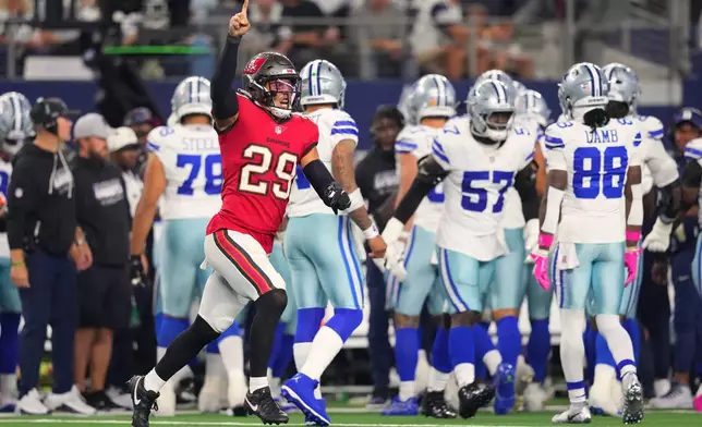 Tampa Bay Buccaneers safety Miles Killebrew (29) celebrates after the Buccaneers recovered a fumbled kickoff return by the Dallas Cowboys in the second half of an NFL football game in Arlington, Texas on Thursday, Oct. 8, 2026. (AP Photo/Julio Cortez)