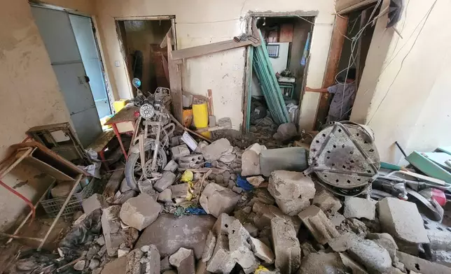 Debris from a home is seen in the Seina district of Taiz, Yemen, after a missile strike, Tuesday, Oct. 20, 2026. (AP Photo/Marzouq Al Jabri)