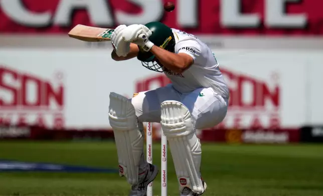South Africa's Wiaan Mulder ducks under the ball on day three of the first cricket test match between South Africa and Australia, in Durban, South Africa, Sunday, Oct. 11, 2026. (AP Photo/Themba Hadebe)