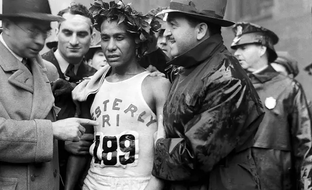 FILE - Ellison M. Brown, winner of the Boston Marathon, is shown in an exhausted state after the race, April 19, 1939. (AP Photo/Abe Fox, File)