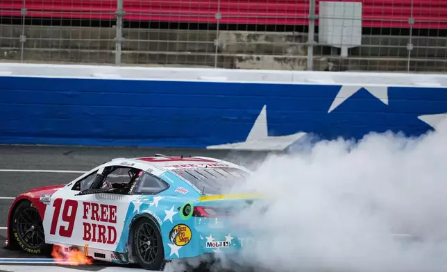 Chase Briscoe does a burnout after winning a NASCAR Cup Series auto race, Sunday, Oct. 11, 2026, in Concord, N.C. (AP Photo/Matt Kelley)