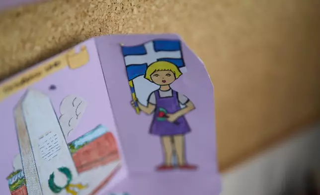A classroom display hangs on a wall inside a kindergarten that has remained closed for a second consecutive school year because of a lack of students on the island of Kalamos in the Ionian Sea, western Greece, Wednesday, Sept. 23, 2026. (AP Photo/Petros Giannakouris)