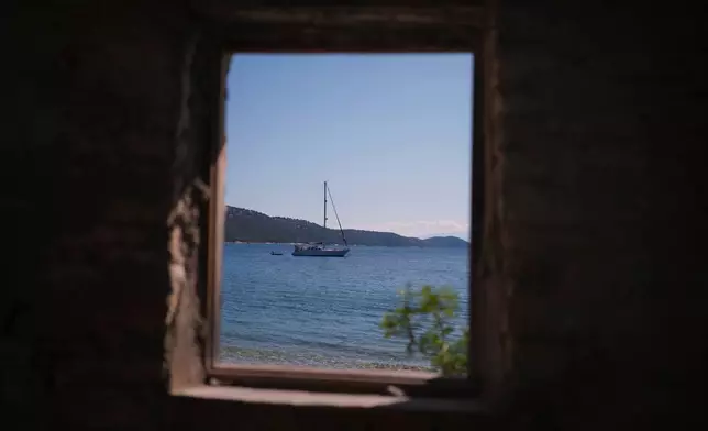 A sailboat is seen off Agrapidia Beach on the island of Kalamos in the Ionian Sea, western Greece, Wednesday, Sept. 23, 2026. (AP Photo/Petros Giannakouris)