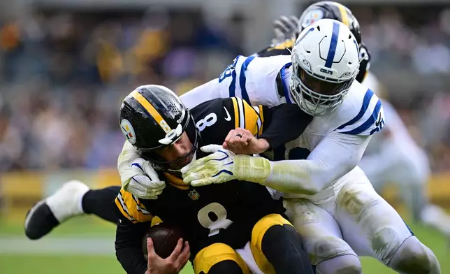 Indianapolis Colts defensive tackle DeForest Buckner (99) sacks Pittsburgh Steelers quarterback Aaron Rodgers (8) during the second half of an NFL football game in Pittsburgh, Sunday, Oct. 11, 2026. (AP Photo/David Dermer )