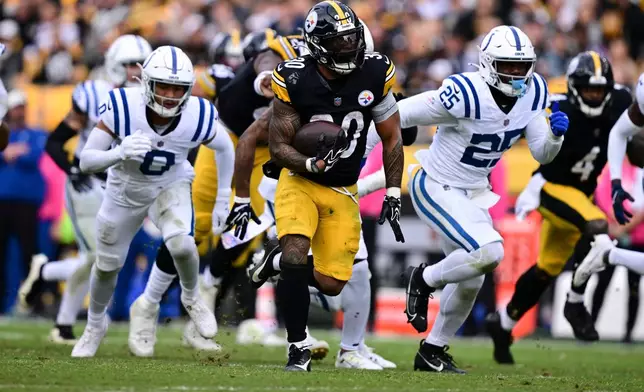 Pittsburgh Steelers running back Jaylen Warren (30) runs for a touchdown against the Indianapolis Colts during the second half of an NFL football game in Pittsburgh, Sunday, Oct. 11, 2026. (AP Photo/David Dermer )