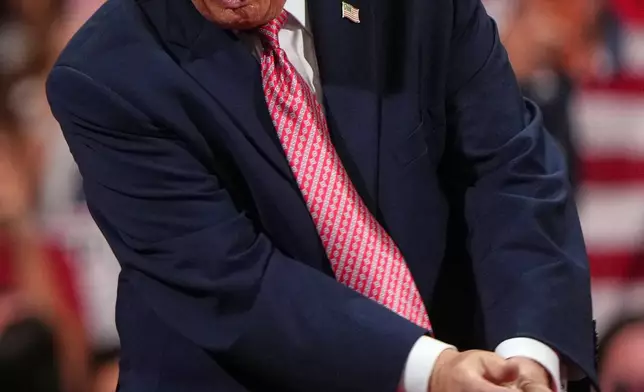 President Donald Trump dances at a campaign rally at Heartland Credit Union Arena, Monday, Oct. 19, 2026, in Park City, Kan. (AP Photo/Charlie Riedel)