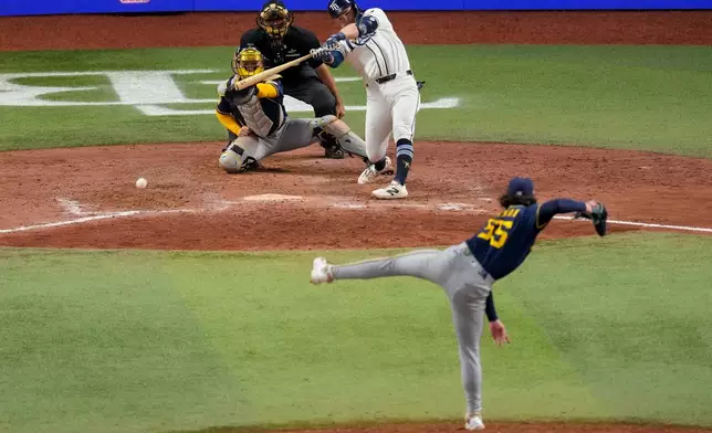 Tampa Bay Rays second baseman Ben Williamson connects for a game-winning RBI single off Milwaukee Brewers pitcher Shane Drohan during the 12th inning of Game 4 of baseball's World Series, Wednesday, Oct. 28, 2026, in St. Petersburg, Fla., between the Milwaukee Brewers and the Tampa Bay Rays. (AP Photo/Morry Gash)