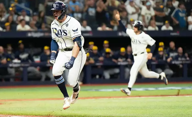 Tampa Bay Rays' Ben Williamson celebrates the game winning hit during the 12th inning of Game 4 of baseball's World Series, Wednesday, Oct. 28, 2026, in St. Petersburg, Fla., between the Milwaukee Brewers and the Tampa Bay Rays. (AP Photo/Ashley Landis)