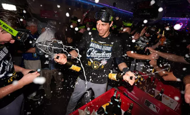 Milwaukee Brewers designated hitter Christian Yelich celebrates winning the NLCS Championship after Game 4 of baseball's National League Championship Series between the Milwaukee Brewers and the Los Angeles Dodgers, Thursday, Oct. 15, 2026, in Los Angeles. (AP Photo/Ashley Landis)