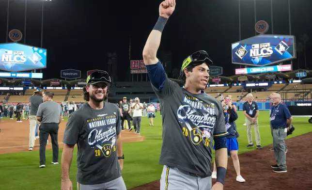Milwaukee Brewers designated hitter Christian Yelich celebrates after Game 4 of baseball's National League Championship Series between the Milwaukee Brewers and the Los Angeles Dodgers, Thursday, Oct. 15, 2026, in Los Angeles. (AP Photo/Gregory Bull)