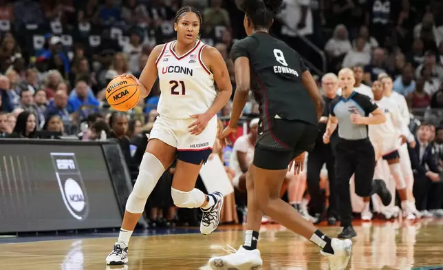 FILE - UConn forward Sarah Strong (21) works against South Carolina during the first half of a woman's NCAA college basketball tournament semifinal game at the Final Four, April 3, 2026, in Phoenix. (AP Photo/Rick Scuteri, File)