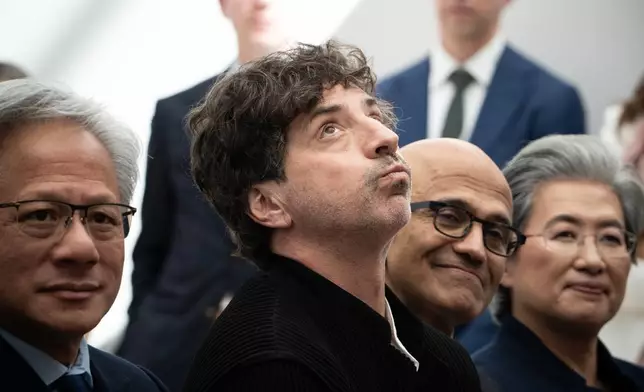 Nvidia CEO Jensen Huang, from left, Google co-Founder Sergey Brin, Microsoft CEO Satya Nadella and Lisa Su, CEO of Advanced Micro Devices, listen to Donald Trump speak at the U.S. Institute of Peace, Thursday, Oct. 8, 2026, in Washington. (AP Photo/Julia Demaree Nikhinson)