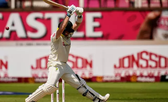 Australia's Steven Smith takes evasive action against a raising ball on day one of the first cricket test match between South Africa and Australia, in Durban, South Africa, Friday, Oct. 9, 2026. (AP Photo/Themba Hadebe)