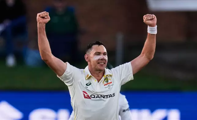 Australia's Scott Boland celebrates the wicket of South Africa's Ryan Rickelton on day two of the second cricket test match between South Africa and Australia, in Gqeberha, South Africa, Monday, Oct. 19, 2026. (AP Photo/Themba Hadebe)