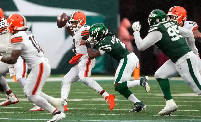 Cleveland Browns quarterback Deshaun Watson is sacked by New York Jets cornerback Jarvis Brownlee Jr. (2) during the second half of an NFL football game, Sunday, Oct. 11, 2026, in East Rutherford, N.J. (AP Photo/Yuki Iwamura)