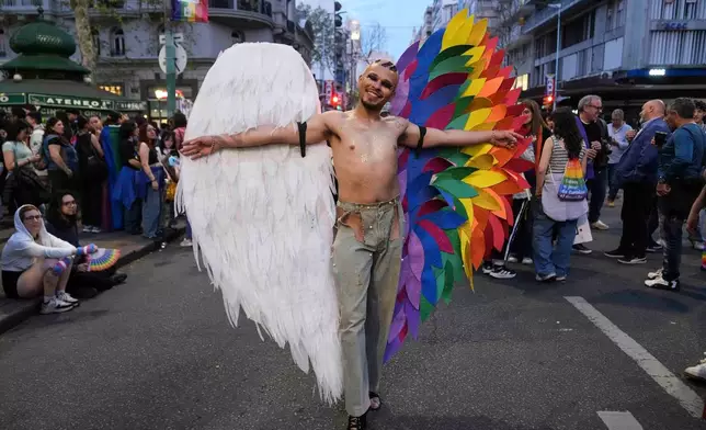 A reveler takes part in a Pride parade in Montevideo, Uruguay, Friday, Sept. 25, 2026. (AP Photo/Matilde Campodonico)