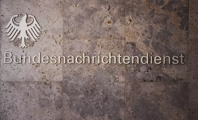 The sign of Germany's foreign intelligence service Bundes Nachrichten Dienst, known as BND, is photographed at an entrance of the headquarters in Berlin, Germany, Wednesday, Oct. 7, 2026. (AP Photo/Markus Schreiber)
