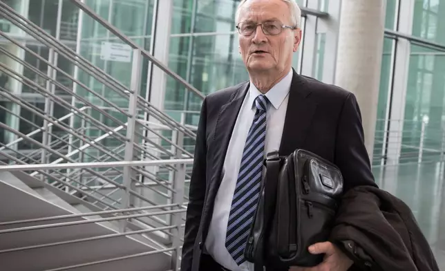 August Hanning, the former president of the Federal Intelligence Service (BND), arrives at the German parliament Bundestag in Berlin on Oct. 2, 2015. (Michael Kappeler/dpa via AP)