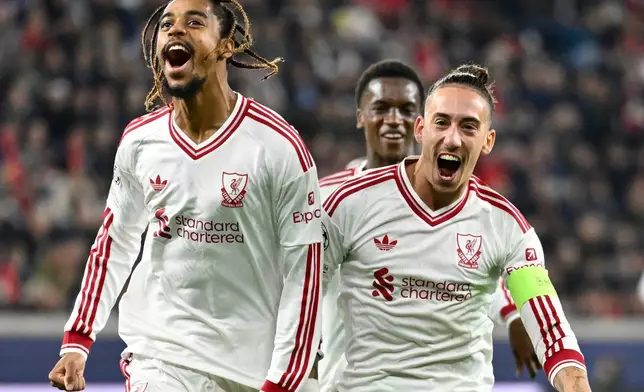 Liverpool's Bradley Barcola, left, celebrates after scoring his side's second goal during the Champions League opening phase soccer match between LASK and Liverpool in Linz, Austria, Wednesday, Oct. 14, 2026. (AP Photo/Denes Erdos)