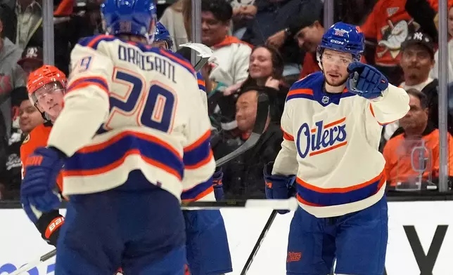 Edmonton Oilers right wing Vasily Podkolzin, right, celebrates his goal with center Leon Draisaitl during the second period of an NHL hockey game against the Anaheim Ducks, Wednesday, Oct. 7, 2026, in Anaheim, Calif. (AP Photo/Mark J. Terrill)