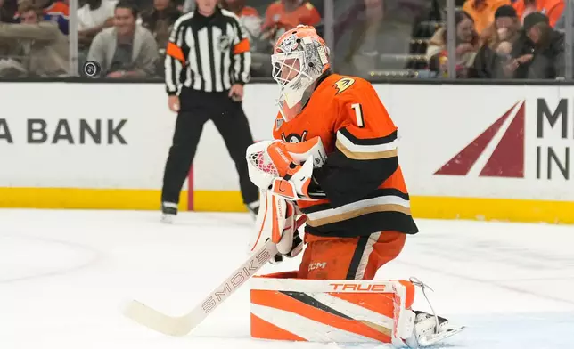 Anaheim Ducks goaltender Lukas Dostal deflects a shot during the first period of an NHL hockey game against the Edmonton Oilers, Wednesday, Oct. 7, 2026, in Anaheim, Calif. (AP Photo/Mark J. Terrill)