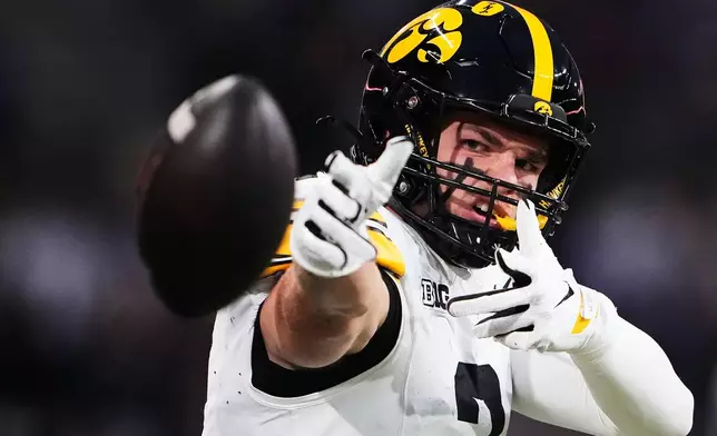 Iowa wide receiver Reece Vander Zee reacts after a catch against Washington during the first half of an NCAA college football game, Friday, Oct. 9, 2026, in Seattle. (AP Photo/Lindsey Wasson)