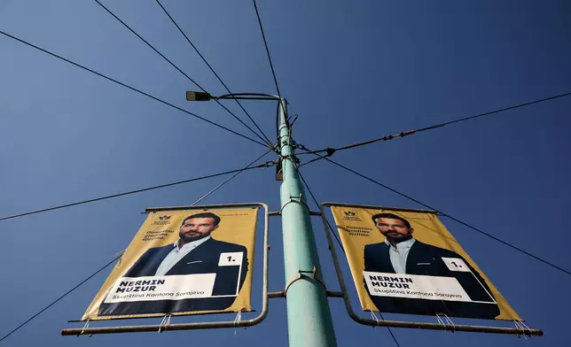 An election poster featuring Nermin Muzur, People and Justice Party (NiP) candidate, hangs from a pole ahead of the upcoming general elections in Sarajevo, Bosnia, on Sept. 29, 2026. (AP Photo/Armin Durgut)