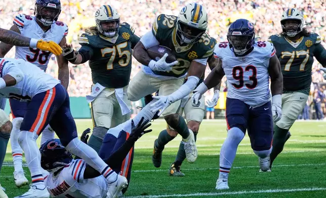 Green Bay Packers' Marshawn Lloyd runs for a touchdown during the first half of an NFL football game against the Chicago Bears in Green Bay, Wis., Sunday, Oct. 11, 2026. (AP Photo/Nam Huh)
