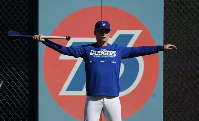 Los Angeles Dodgers pitcher Yoshinobu Yamamoto works out before Game 1 of a National League Division Series baseball game against the Atlanta Braves Saturday, Oct. 3, 2026, in Los Angeles. (AP Photo/Jae C. Hong)