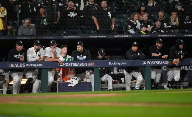 Chicago White Sox players watch from the dugout during the ninth inning in Game 4 of baseball's American League Division Series against the Cleveland Guardians, Thursday, Oct. 8, 2026, in Chicago. (AP Photo/Nam Huh)
