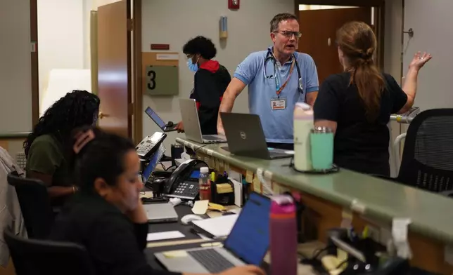 Doctors work at the nonprofit, Union Community Care clinic, in Lancaster, Pa., on Thursday, Oct. 8, 2026. (AP Photo/Jessie Wardarski)