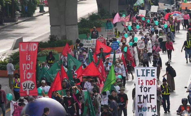 Demonstrations against the International Monetary Fund and the World Bank Group, march to the meeting venue during a protest in Bangkok, Thailand, Thursday, Oct. 15, 2026. (AP Photo/Sakchai Lalit)