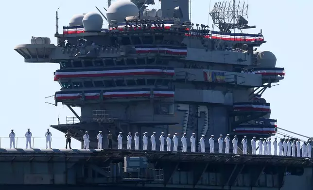 The USS Abraham Lincoln aircraft carrier returns to the San Diego Bay after deployment Thursday, Oct. 8, 2026, in San Diego. (AP Photo/Karl Anderson)