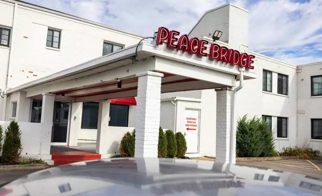 A sign is displayed for Peace Bridge Place apartments that have Viridi's lithium-ion battery energy storage system in Buffalo, N.Y., Thursday, Oct. 15, 2026. (AP Photo/Lauren Petracca)