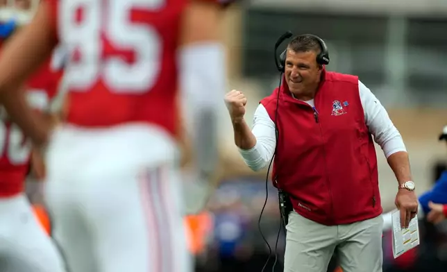 New England Patriots head coach Mike Vrabel celebrates his team's touchdown against the Las Vegas Raiders during an NFL football game in Foxborough, Mass., Sunday, Oct. 11, 2026. (AP Photo/Charles Krupa)