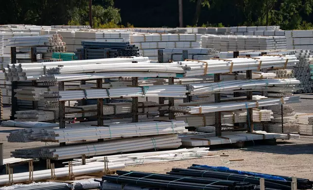 PVC pipe is stacked at the IPEX factory that makes the pipes Thursday, Sept. 3, 2026, in Woodfin, N.C. (AP Photo/Allison Joyce)