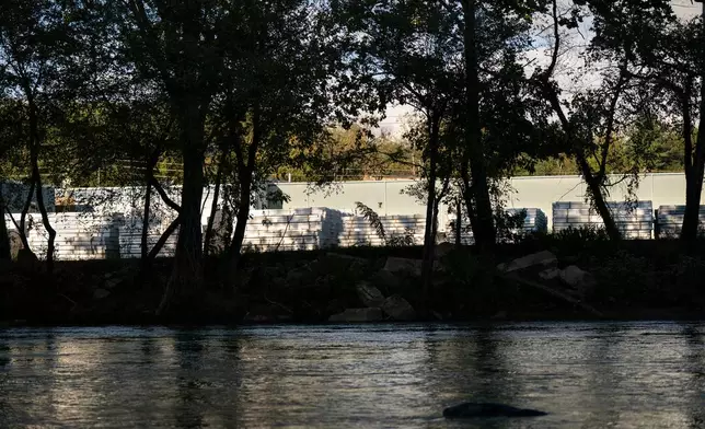 PVC pipe is stacked at the IPEX factory as visible from the French Broad River, Thursday, Sept. 24, 2026, in Woodfin, N.C. (AP Photo/Allison Joyce)