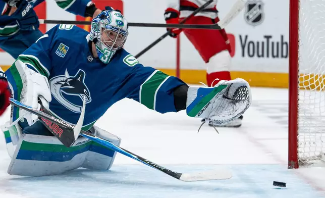 Carolina Hurricanes' Nikolaj Ehlers, not seen, scores on Vancouver Canucks goaltender Leevi Merilainen (31) during the first period of an NHL hockey game in Vancouver on Tuesday, Oct. 20, 2026. (Ethan Cairns/The Canadian Press via AP)