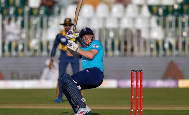 England's Harry Brook follows the ball after playing a shot for boundary during the tri-series one-day international cricket match between Sri Lanka and England, in Rawalpindi, Pakistan, Thursday, Oct. 22, 2026. (AP Photo/Anjum Naveed)