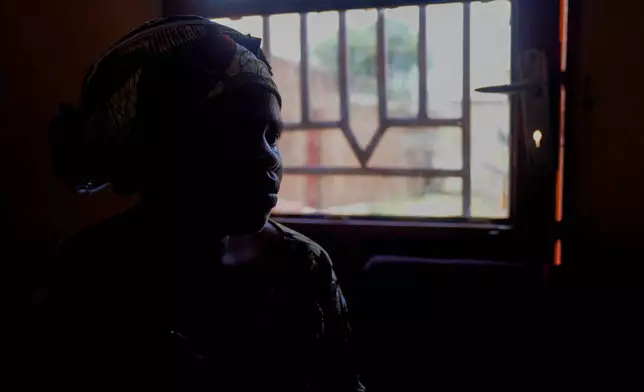 A woman sits in a psychotherapeutic health center to receive mental health support after losing two family members and several close associates to Ebola virus, in Bunia, Congo, Thursday, Oct. 15, 2026. (AP Photo/Dieudonne Dirole)