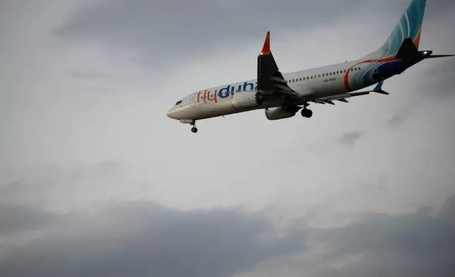 An FlyDubai plane carrying Israeli passengers who had earlier been aboard another FlyDubai aircraft that made an emergency landing in Saudi Arabia approaches Ben Gurion International Airport near Tel Aviv, Israel, Wednesday, Sept. 30, 2026. (AP Photo/Ohad Zwigenberg)