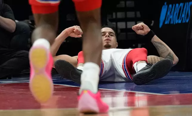 Brooklyn Nets' Michael Porter Jr. reacts after sinking a basket during the second half of an NBA basketball game against the Charlotte Hornets Wednesday, Oct. 21, 2026, in New York. (AP Photo/Seth Wenig)