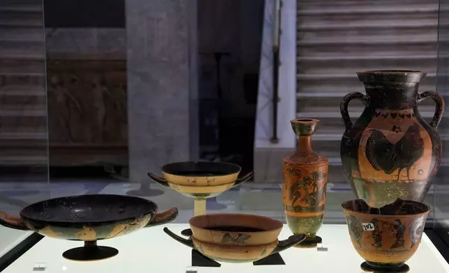 Greek antiquities dating to the 6th and 5th centuries B.C. are displayed during a repatriation ceremony at the National Archaeological Museum in Athens, Greece, Tuesday, Oct. 13, 2026, after 22 artifacts illegally removed from Greece were returned by Israel. (AP Photo/Thanassis Stavrakis)