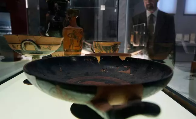 Greek antiquities dating to the 6th and 5th centuries B.C. are displayed during a repatriation ceremony at the National Archaeological Museum in Athens, Greece, Tuesday, Oct. 13, 2026, after 22 artifacts illegally removed from Greece were returned by Israel. (AP Photo/Thanassis Stavrakis)